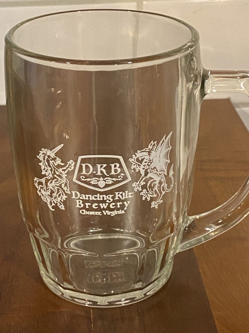A Clear Glass With Dancing Kilt Engraved