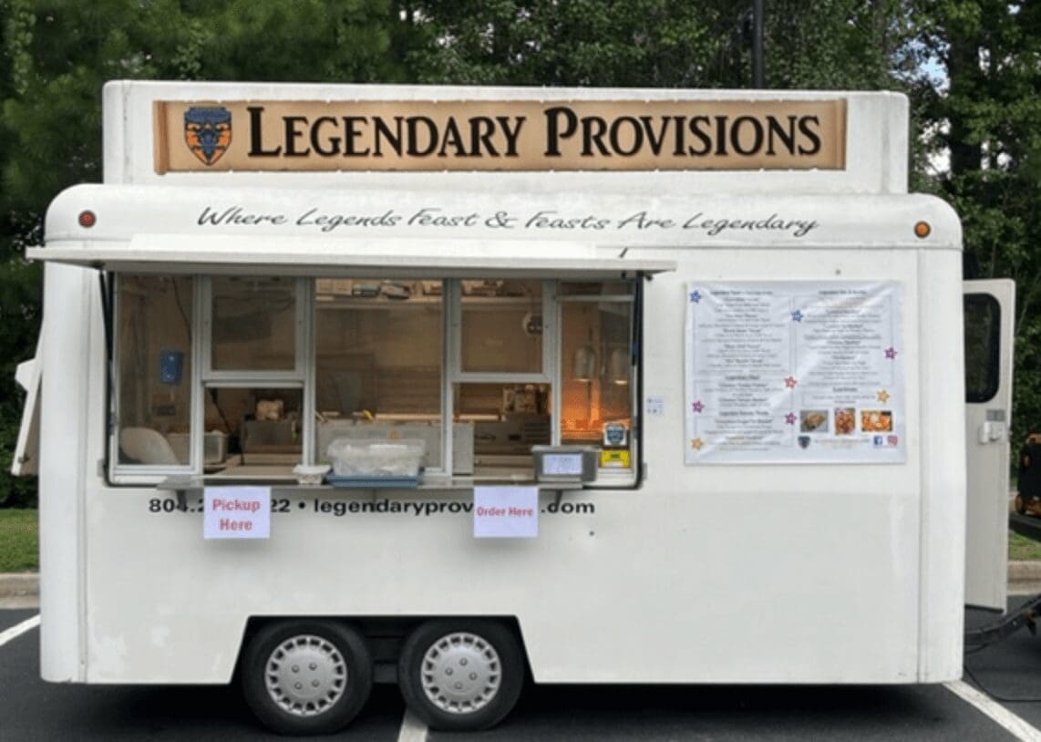 A food truck with a sign that says legendary provisions.