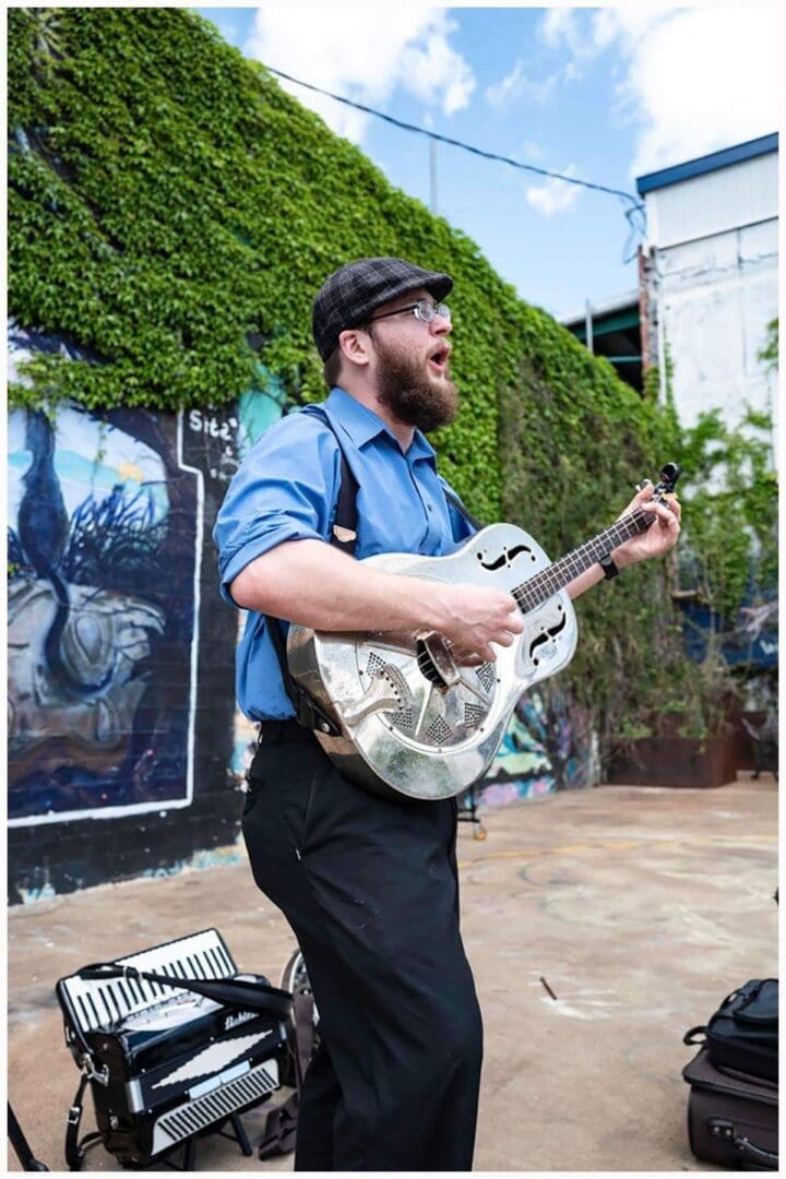 Matt O'Donnel With a Guitar Outdoor