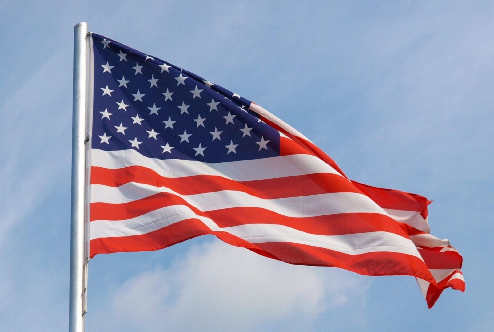 An american flag flying in the wind.