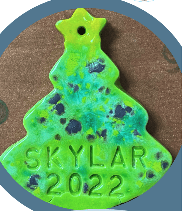 A green christmas tree ornament with the name skylar 2020.